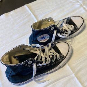 Black high top Converse.